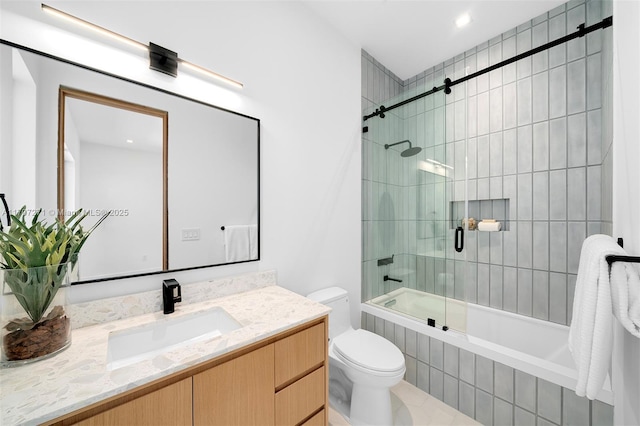 full bathroom featuring tile patterned floors, vanity, bath / shower combo with glass door, and toilet