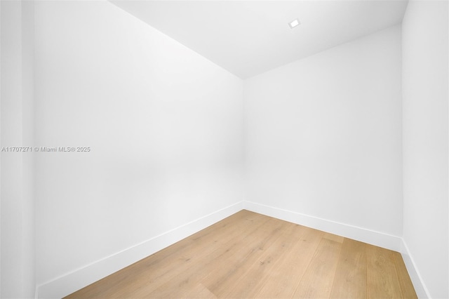 empty room with hardwood / wood-style floors