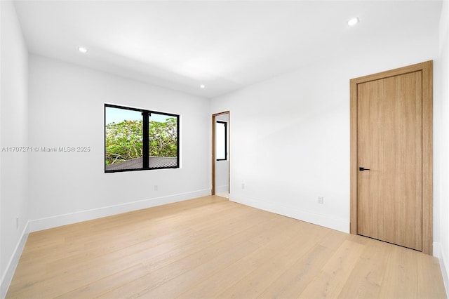 spare room with light wood-type flooring