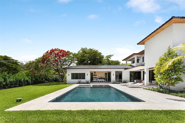 exterior space featuring a patio area and a lawn