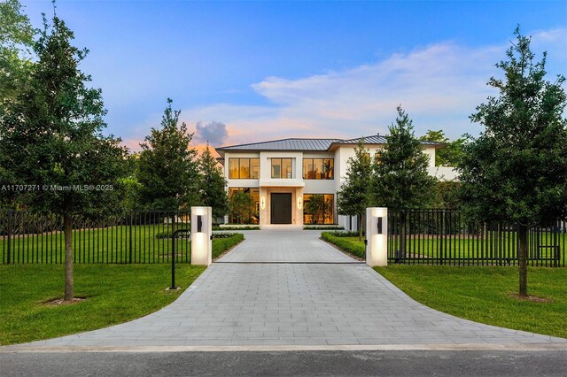 modern home featuring a front yard