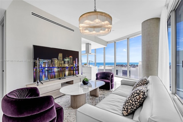 living room featuring a chandelier and floor to ceiling windows