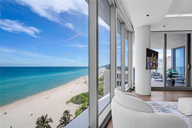 interior space featuring a view of the beach and a water view