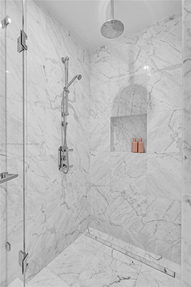 bathroom featuring an enclosed shower