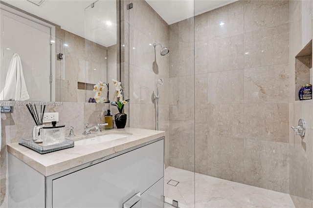 bathroom featuring a tile shower, tile walls, and tasteful backsplash