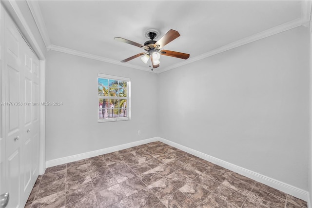 spare room with ceiling fan and ornamental molding