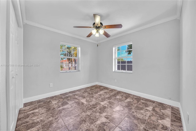 spare room featuring crown molding and ceiling fan