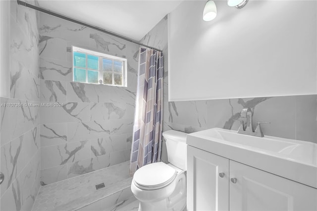 bathroom featuring a shower with curtain, toilet, tile walls, and vanity