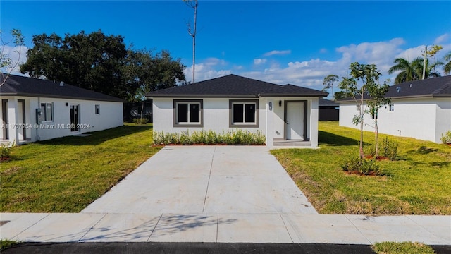 ranch-style house with a front lawn