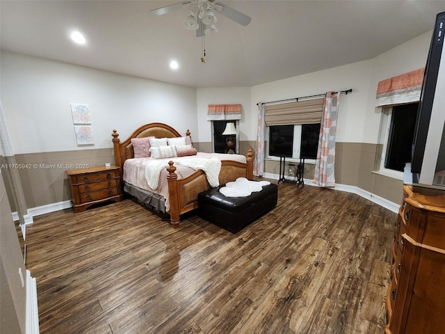 bedroom with dark hardwood / wood-style floors and ceiling fan