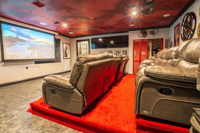 cinema featuring carpet floors and ornamental molding