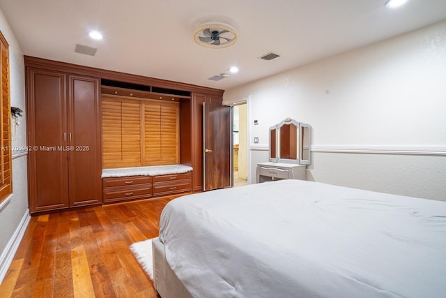 bedroom with hardwood / wood-style flooring