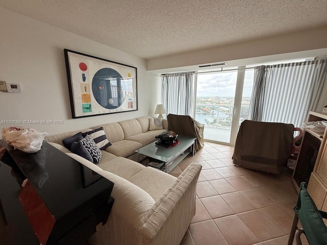 tiled living room with a textured ceiling