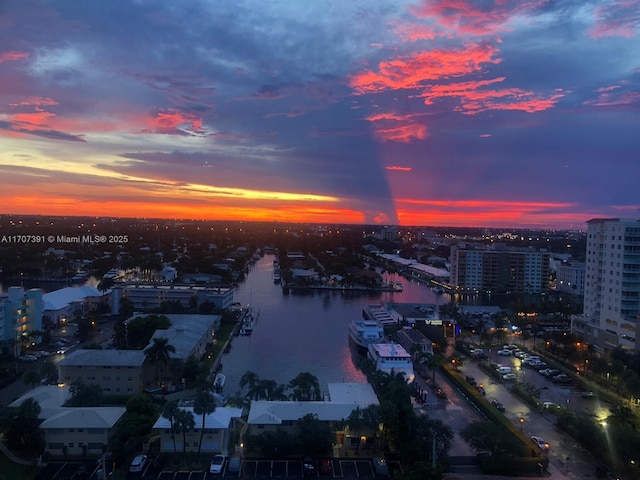 aerial view at dusk with a water view