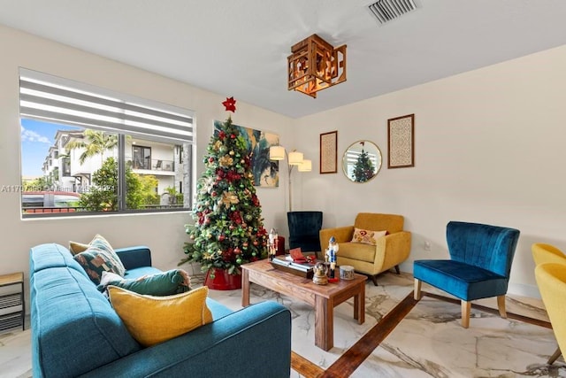 sitting room with hardwood / wood-style flooring