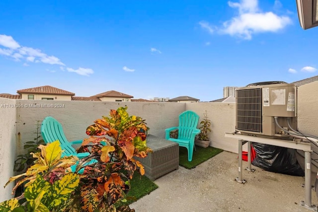 view of yard featuring cooling unit and a patio