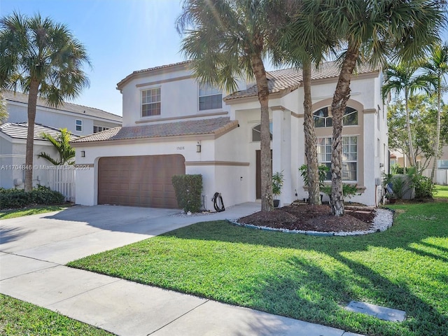 mediterranean / spanish-style house with a front lawn and a garage