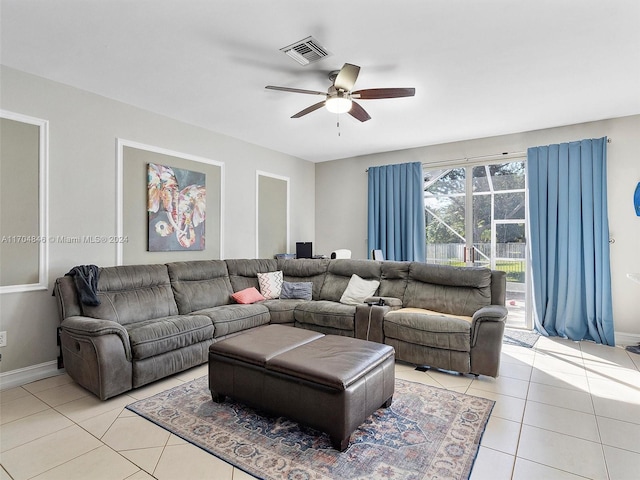 tiled living room with ceiling fan