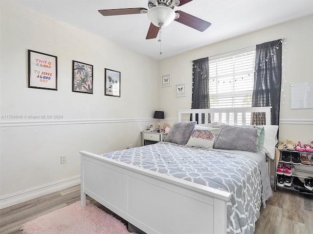 bedroom featuring light hardwood / wood-style flooring and ceiling fan