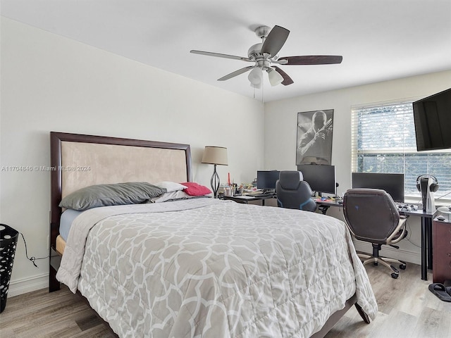 bedroom featuring ceiling fan and hardwood / wood-style flooring