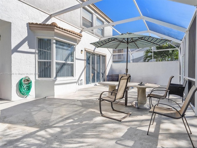 view of patio with a lanai