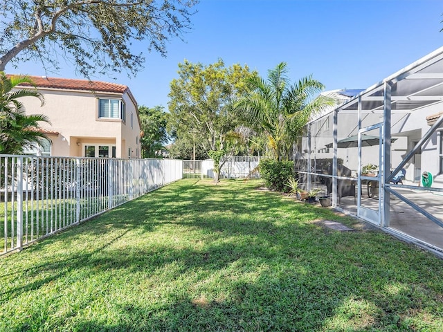 view of yard featuring a lanai