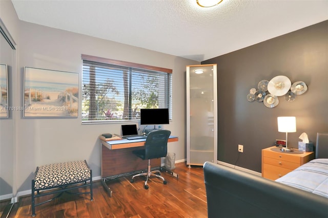 office featuring dark hardwood / wood-style flooring and a textured ceiling