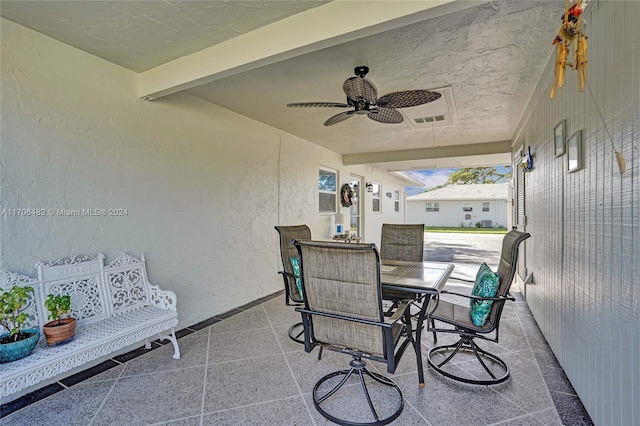 view of patio / terrace featuring ceiling fan