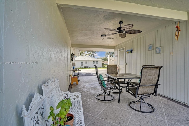 view of patio / terrace featuring ceiling fan