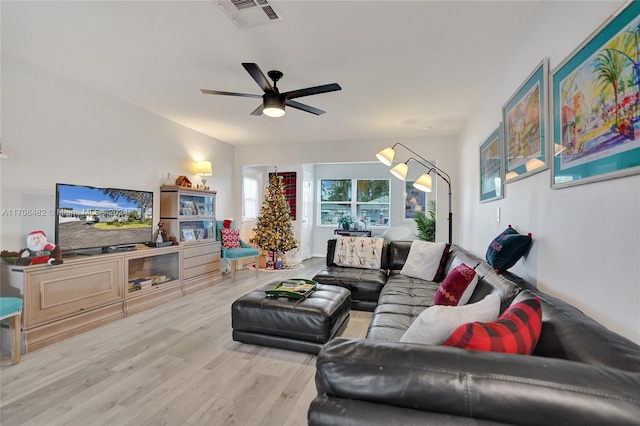 living room with ceiling fan and hardwood / wood-style floors