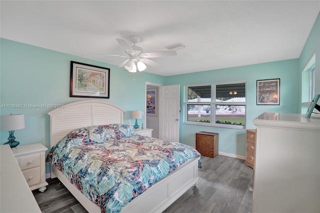 bedroom with ceiling fan and hardwood / wood-style floors