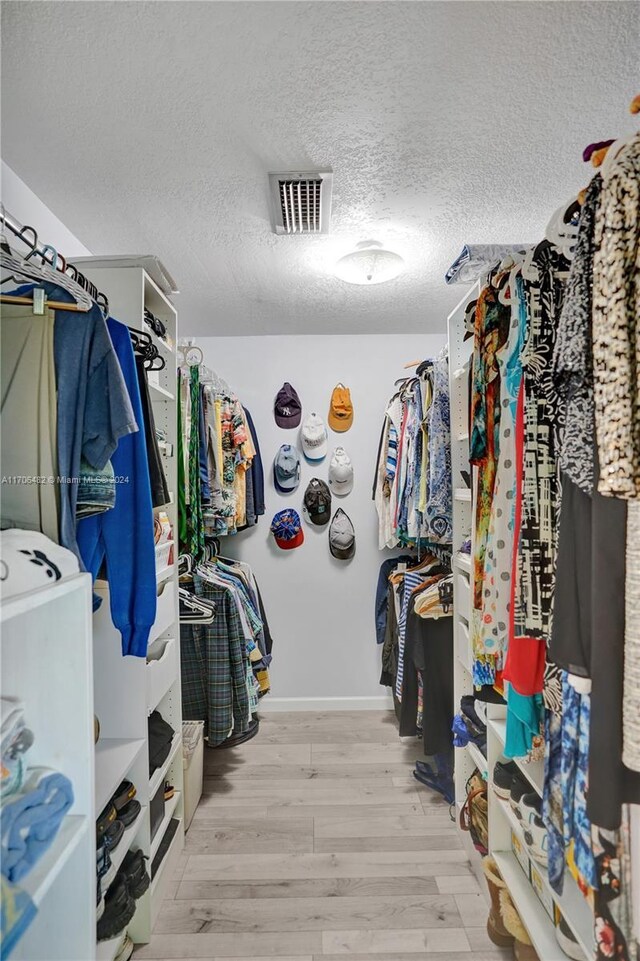 walk in closet featuring light wood-type flooring