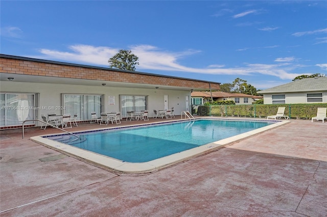 view of pool featuring a patio