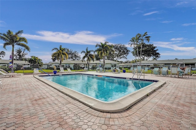 view of swimming pool featuring a patio area