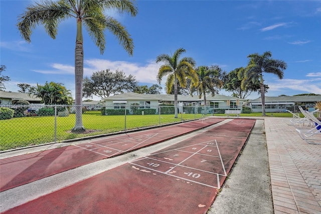 view of home's community with a lawn