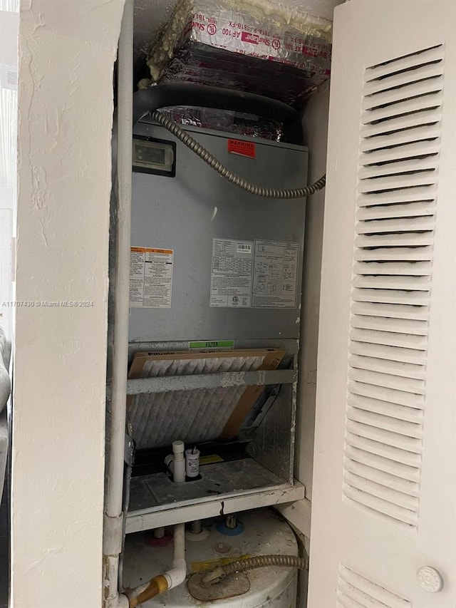 utility room with heating unit