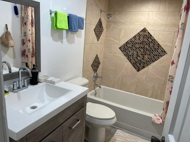 full bathroom with vanity, shower / tub combo, and toilet