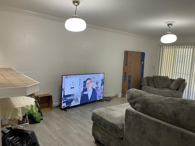 living room with light wood-type flooring and crown molding