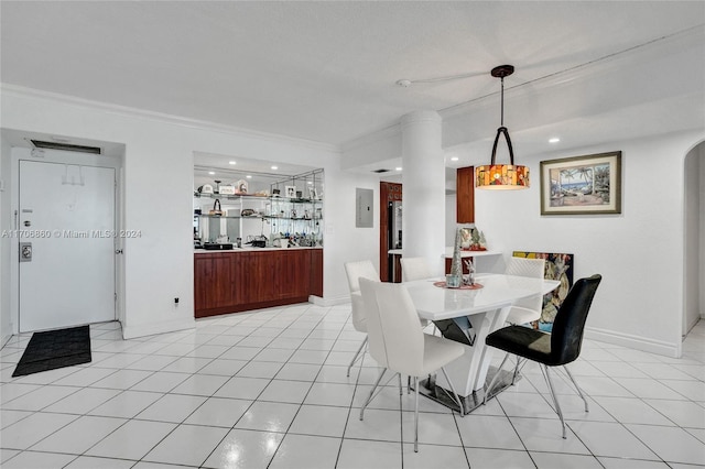 tiled dining area with electric panel and crown molding