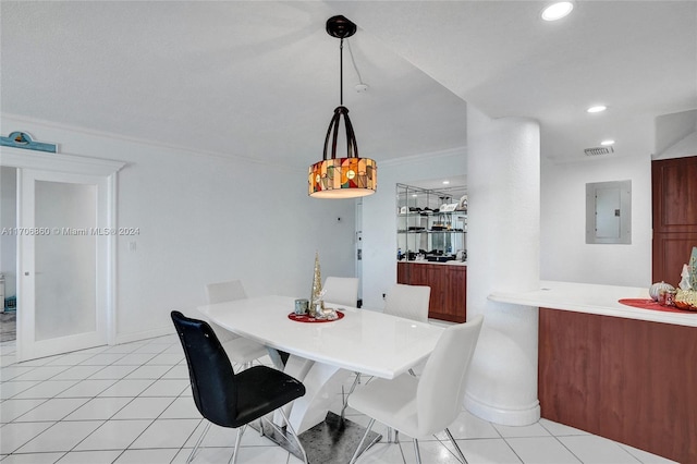 dining space with electric panel, light tile patterned floors, and ornamental molding