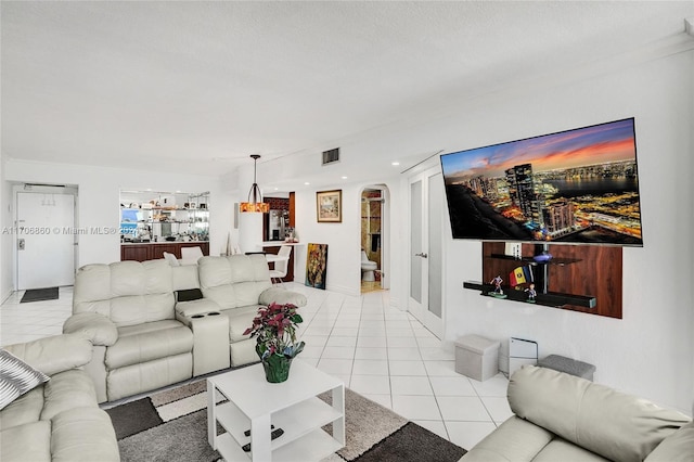 tiled living room with a textured ceiling