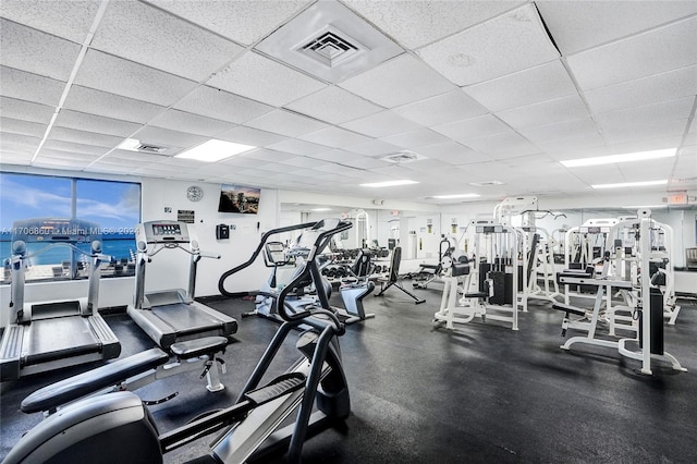 gym featuring a paneled ceiling