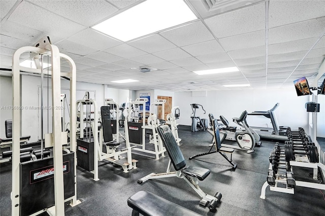 exercise room with a drop ceiling