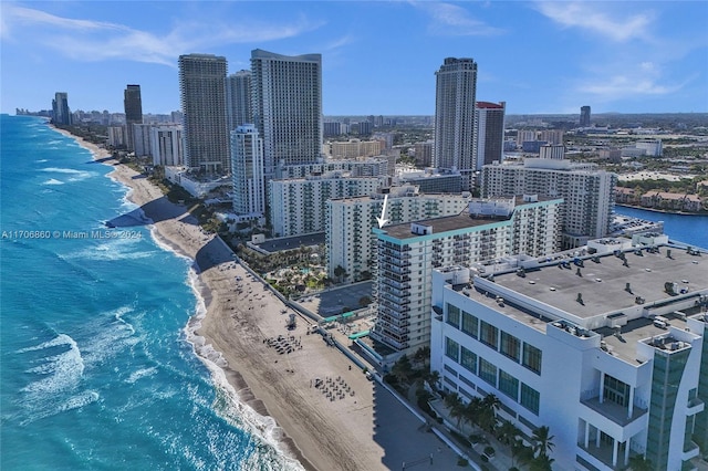 property's view of city featuring a beach view and a water view