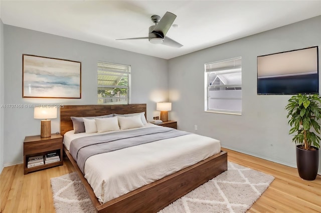 517 S 19th Ave, Hollywood, FL 33020 - bedroom featuring light wood-style floors, a ceiling fan, and baseboards