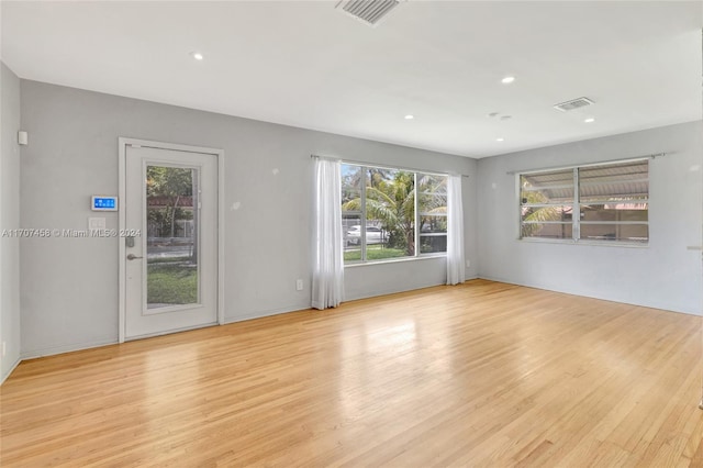 unfurnished living room featuring light wood-type flooring