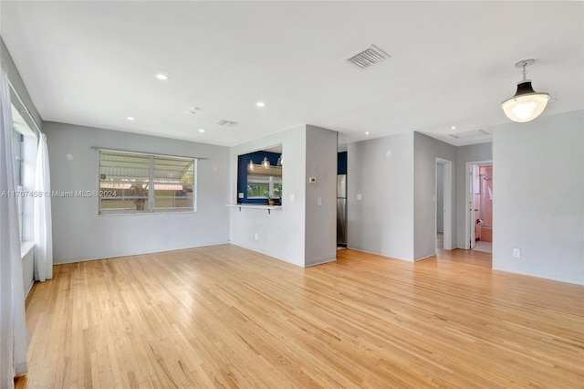 unfurnished living room featuring light hardwood / wood-style flooring