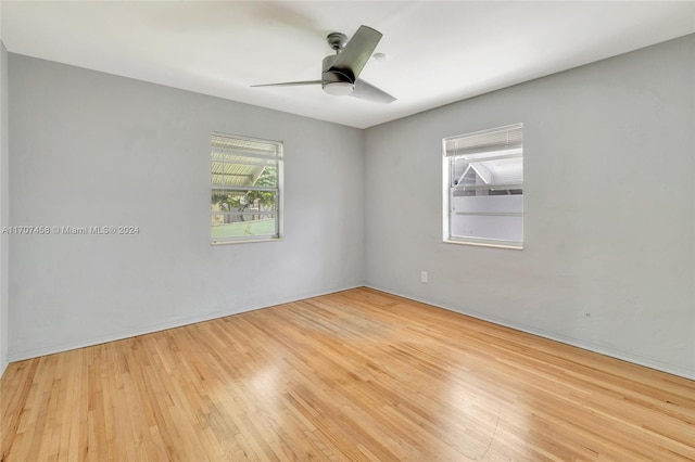 empty room with light hardwood / wood-style floors and ceiling fan