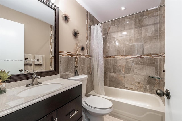 full bathroom with vanity, toilet, and shower / bath combo with shower curtain