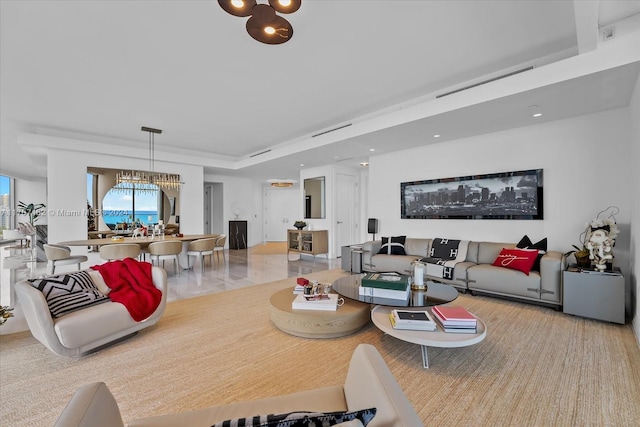 living room featuring an inviting chandelier